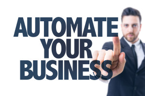 Automate Your Business Text with person pointing at the reader.