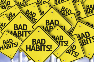 Yellow Road Signs that read 'BAD HABITS!'