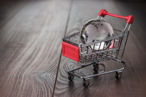 Shopping Cart on wood floor carrying metal ball