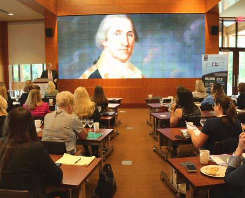 Classroom Filled with Women Looking at Presentation