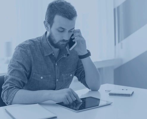 Man on Phone whilst using E-notepad