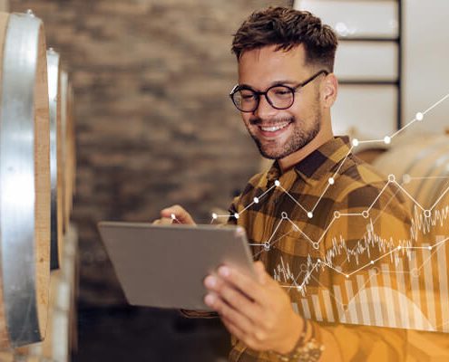 Person holding notepad with data on right side visualized