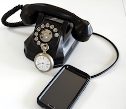 Rotary phone with a stopwatch and a cable connecting to smartphone