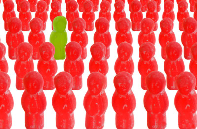 Many Red Gummy People with one Green one