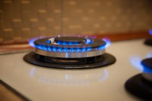 Black Stove Burners ignited with nothing on top, brown background