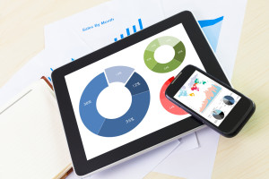 Phone and tablet with pie charts(tablet) and varying kinds(phone)