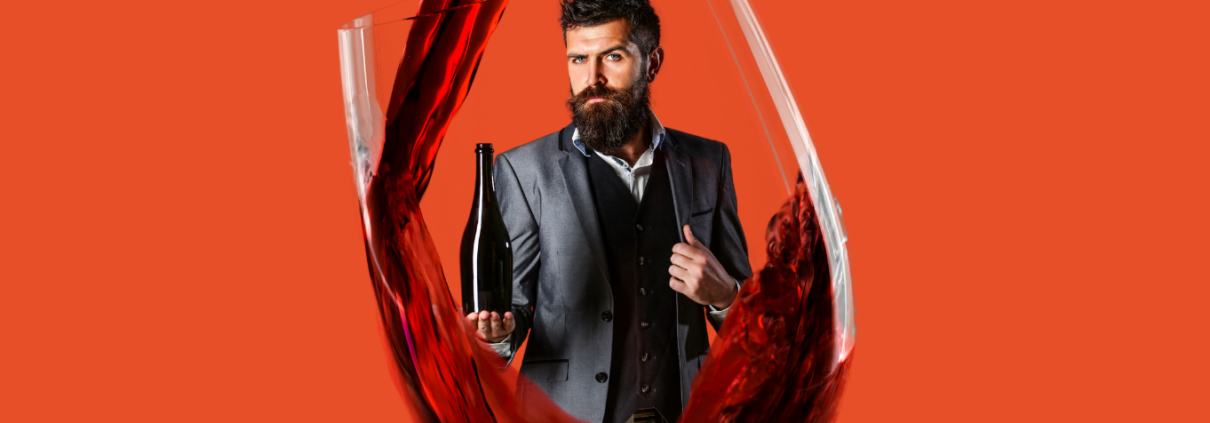 sommelier holding bottle in a wine glass wine and spirits